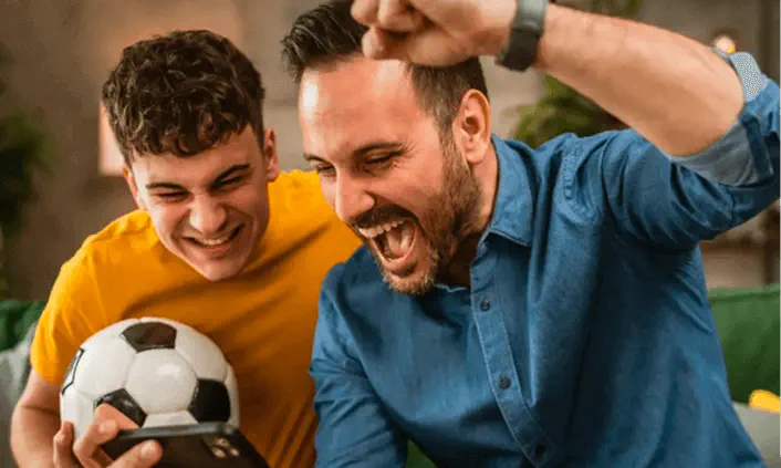 Fans celebrating with soccer ball